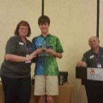 Mason Lessig receiving his award at the Youth State Annual Luncheon in St Pete, October 2022